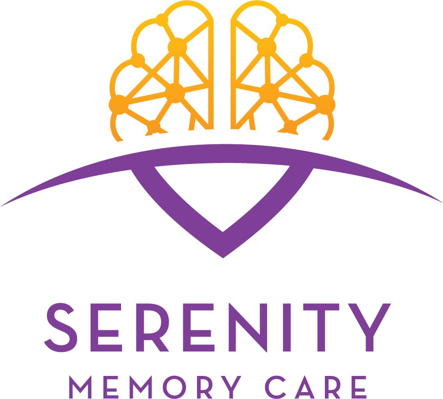 Logo of Serenity Memory Care featuring a stylized brain graphic in yellow and orange, symbolizing cognitive health, with a purple arch below the text "Serenity Memory Care," representing compassionate support for individuals with memory-related challenges.